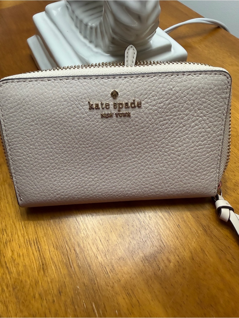 kate spade pale pink pebbled leather zip wallet with gold logo